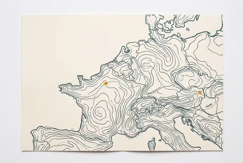 Map lines and a travel route on paper